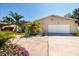 Charming single-story home with a well-maintained lawn, mature palms, and a two-car garage at 6001 19Th Ne St, St Petersburg, FL 33703