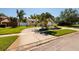 Well-maintained home with a circular driveway and manicured lawn at 6001 19Th Ne St, St Petersburg, FL 33703