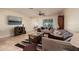 Inviting living room with neutral tones, ceiling fan, tile floors and comfortable seating arrangement at 6001 19Th Ne St, St Petersburg, FL 33703