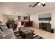 Open-concept living room flows into the kitchen, featuring tile floors and a ceiling fan at 6001 19Th Ne St, St Petersburg, FL 33703