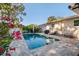 Inviting pool area with brick pavers, ample seating, and lush landscaping at 6001 19Th Ne St, St Petersburg, FL 33703