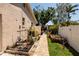 A walkway alongside the house, featuring flowerbeds and garden at 6001 19Th Ne St, St Petersburg, FL 33703