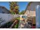 A walkway alongside the house, featuring flowerbeds and garden at 6001 19Th Ne St, St Petersburg, FL 33703