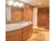 Modern bathroom with granite countertop vanity and a tiled walk-in shower at 6060 Shore S Blvd # 302, Gulfport, FL 33707