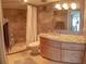 Updated bathroom with granite countertops, tiled shower with seat, and ample storage at 6060 Shore S Blvd # 302, Gulfport, FL 33707