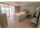 Bright bedroom with tile floors, ceiling fan, and serene decor at 6060 Shore S Blvd # 302, Gulfport, FL 33707