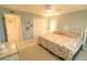 Comfortable bedroom features neutral decor, a ceiling fan, and convenient closet access at 6060 Shore S Blvd # 302, Gulfport, FL 33707