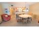 Cozy dining space connecting to the kitchen area, complemented by a comfortable armchair at 6060 Shore S Blvd # 302, Gulfport, FL 33707