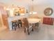 Inviting dining area adjacent to the kitchen, with a round table and seating for six at 6060 Shore S Blvd # 302, Gulfport, FL 33707