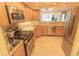 Well-equipped kitchen featuring modern stainless steel appliances, stylish cabinetry, and granite countertops at 6060 Shore S Blvd # 302, Gulfport, FL 33707