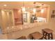 Stylish kitchen with granite countertops, stainless steel appliances, and a breakfast bar with seating at 6060 Shore S Blvd # 302, Gulfport, FL 33707