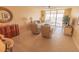 Comfortable living room with water views, a ceiling fan, and access to a screened balcony at 6060 Shore S Blvd # 302, Gulfport, FL 33707