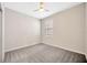 This cozy bedroom has carpeted floors and a view at 6398 Bradford Woods Drive, Zephyrhills, FL 33542