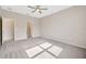 Spacious bedroom featuring a ceiling fan, neutral paint and soft carpet at 6398 Bradford Woods Drive, Zephyrhills, FL 33542