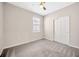 This bedroom has carpeted floors and natural light from a window at 6398 Bradford Woods Drive, Zephyrhills, FL 33542