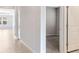 Hallway view of a living area and a bedroom with carpeted floors at 6398 Bradford Woods Drive, Zephyrhills, FL 33542