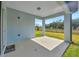 Covered patio offering view of back yard at 6398 Bradford Woods Drive, Zephyrhills, FL 33542