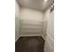 Spacious walk-in closet with shelving provides ample storage at 6398 Bradford Woods Drive, Zephyrhills, FL 33542