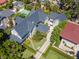 Stunning aerial view of a luxury home featuring a well-manicured lawn, elegant landscaping, and a dark roof at 712 S Newport Ave, Tampa, FL 33606