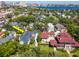 Expansive aerial shot of an upscale neighborhood, showcasing a large home with beautiful surroundings and city views at 712 S Newport Ave, Tampa, FL 33606