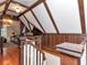 Unique attic space with paneled walls, exposed beams, and hardwood floors at 712 S Newport Ave, Tampa, FL 33606