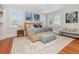Bright bedroom filled with natural light features hardwood floors and tasteful decor at 712 S Newport Ave, Tampa, FL 33606