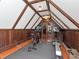 Spacious attic gym with wood paneled walls and state of the art equipment at 712 S Newport Ave, Tampa, FL 33606