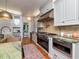 Gourmet kitchen features custom cabinetry, stainless steel appliances, and a stunning stone countertop at 712 S Newport Ave, Tampa, FL 33606