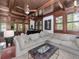 Spacious living room features a cozy seating area and a grand piano, perfect for entertaining at 712 S Newport Ave, Tampa, FL 33606