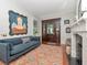 Cozy living room with hardwood floors, a fireplace, and a comfortable seating area at 712 S Newport Ave, Tampa, FL 33606