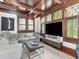 Elegant living room boasts coffered ceilings, hardwood floors, and lots of natural light at 712 S Newport Ave, Tampa, FL 33606