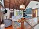 Cozy living room area with hardwood floors, wooden ceiling beams, and wet bar at 712 S Newport Ave, Tampa, FL 33606