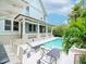 Sparkling pool with lounge chairs and the house in the background, offering a resort-like atmosphere at 712 S Newport Ave, Tampa, FL 33606