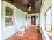 Relaxing front porch with wood floors, rocking chairs, and a charming, inviting atmosphere at 712 S Newport Ave, Tampa, FL 33606