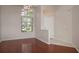Inviting entryway featuring hardwood floors and an abundance of natural light at 717 Lighthouse Dr, Tarpon Springs, FL 34689