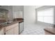 Kitchen with stainless steel appliances and a view into the adjacent living area at 717 Lighthouse Dr, Tarpon Springs, FL 34689