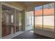 A screened lanai with outdoor access shows entry into the main bedroom and a glimpse of the back yard at 717 Lighthouse Dr, Tarpon Springs, FL 34689