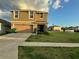 Charming two-story home with a two-car garage, manicured lawn, and inviting entrance at 7530 Broad Pointe Dr, Zephyrhills, FL 33540