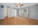 Spacious bedroom with hardwood floors, ceiling fan, and natural light at 8111 Country Club N Rd, St Petersburg, FL 33710