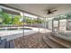 An inviting covered patio area next to the pool and hot tub at 8111 Country Club N Rd, St Petersburg, FL 33710