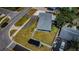 Aerial view showcasing the home's layout with a large backyard, driveway, and proximity to the street at 8201 Ridge Rd, Seminole, FL 33772