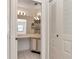 Bathroom with a spacious vanity and a view of the bathtub at 8206 Leafy Ct, Port Richey, FL 34668