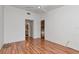 Bright bedroom with hardwood floors, white walls, and a ceiling fan at 8206 Leafy Ct, Port Richey, FL 34668