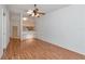 Hardwood floor throughout living room, ceiling fan, and lots of natural light at 8206 Leafy Ct, Port Richey, FL 34668