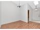 Inviting living area with hardwood floors, a skylight, and a neutral color scheme at 8206 Leafy Ct, Port Richey, FL 34668