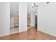 Bright living area featuring hardwood floors and an open layout leading to the kitchen at 8206 Leafy Ct, Port Richey, FL 34668