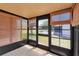 Enclosed sunroom with tile floor and sliding glass doors at 8206 Leafy Ct, Port Richey, FL 34668