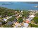 Expansive aerial view of a waterfront neighborhood with lush trees and various home styles at 8326 40Th N Pl, St Petersburg, FL 33709