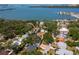 Aerial shot of a tranquil, tree-lined neighborhood nestled along the waterfront with diverse homes at 8326 40Th N Pl, St Petersburg, FL 33709