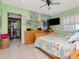 Bedroom featuring access to the outdoor pool area, offering a tranquil and inviting space at 8326 40Th N Pl, St Petersburg, FL 33709